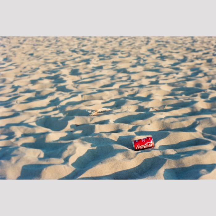 coca cola can in sand dunes