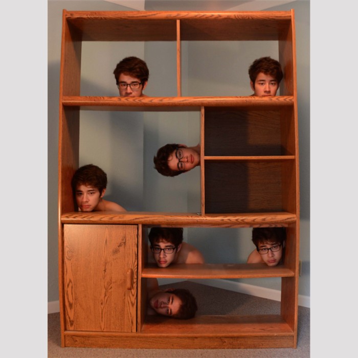 young man trick photograph doubles heads cabinet